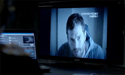 Paul Spector looks at the camera