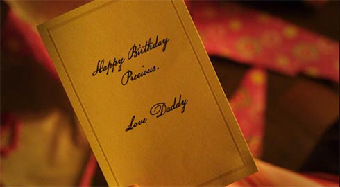 A card that says "Happy Birthday Princess. Love, Daddy"