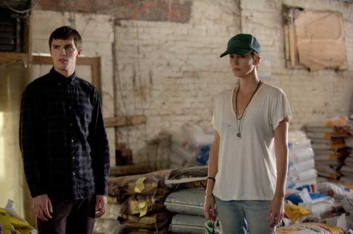 Still of Charlize Theron and Nicholas Hoult in Dark Places
