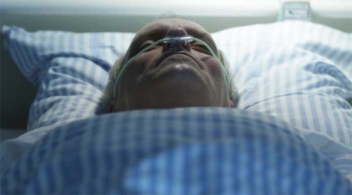 Dicte's father in a hospital bed