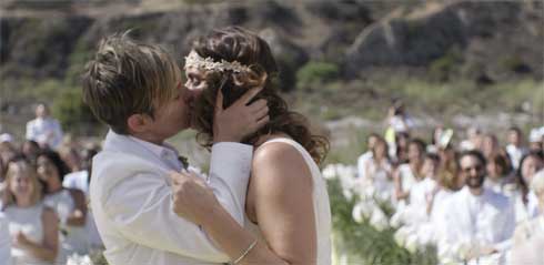 Tammy and Sarah kiss at their wedding