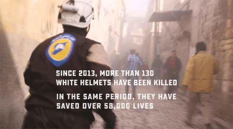 man in The White Helmets runs to a bombing site