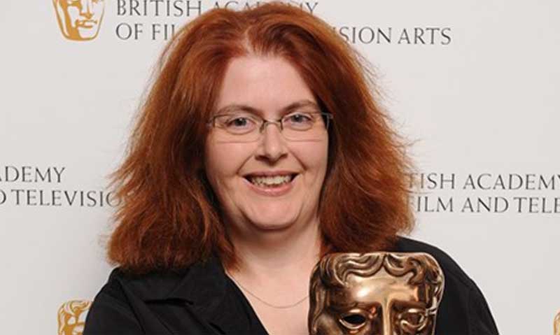 Sally Wainwright holding a BAFTA