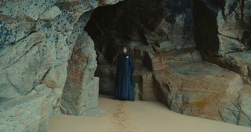 Héloïse waits in a rocky cave in Portrait of a Lady on Fire