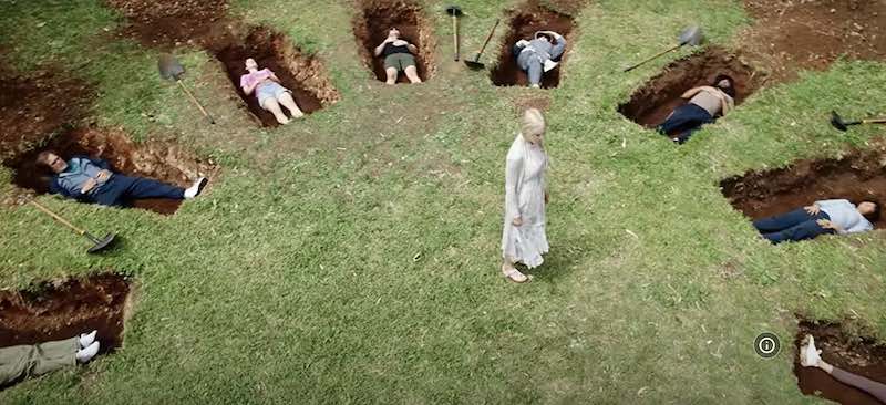A scene from Nine Perfect Strangers where people have dug their own graves