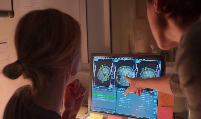 women look at brain scans in The Principles of Pleasure