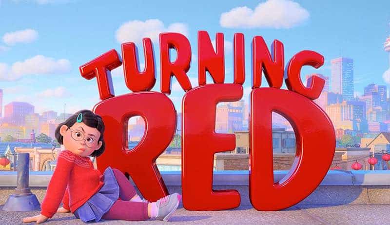 Meilin in front of a Turning Red sign