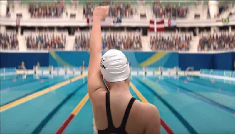 Nathalie Issa raises a fist in The Swimmers